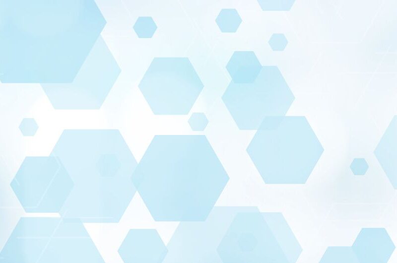 Light blue hexagons of varying sizes are scattered across a white background, creating a soft, abstract, and modern geometric pattern with a subtle bokeh effect—reminiscent of imagery often seen in radiology.